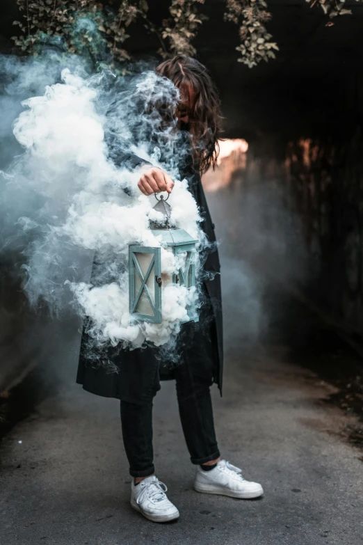 an altered image shows a person's body coming out of a box while the clouds form steam