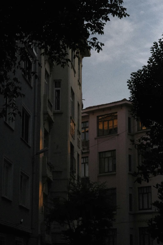 a clock tower with light on during sunset