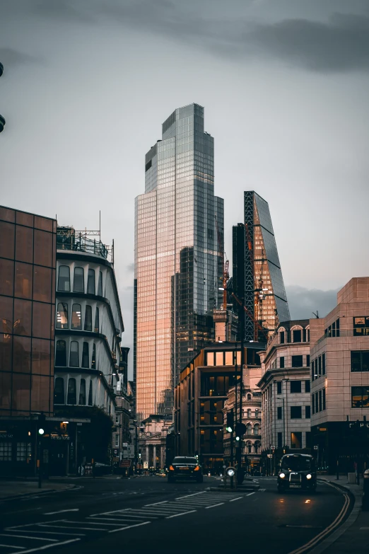 some very tall buildings in a city at night