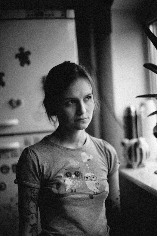 a woman is standing in the dark with a tooth brush