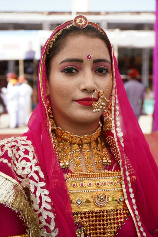 a woman dressed in an elaborately colored dress