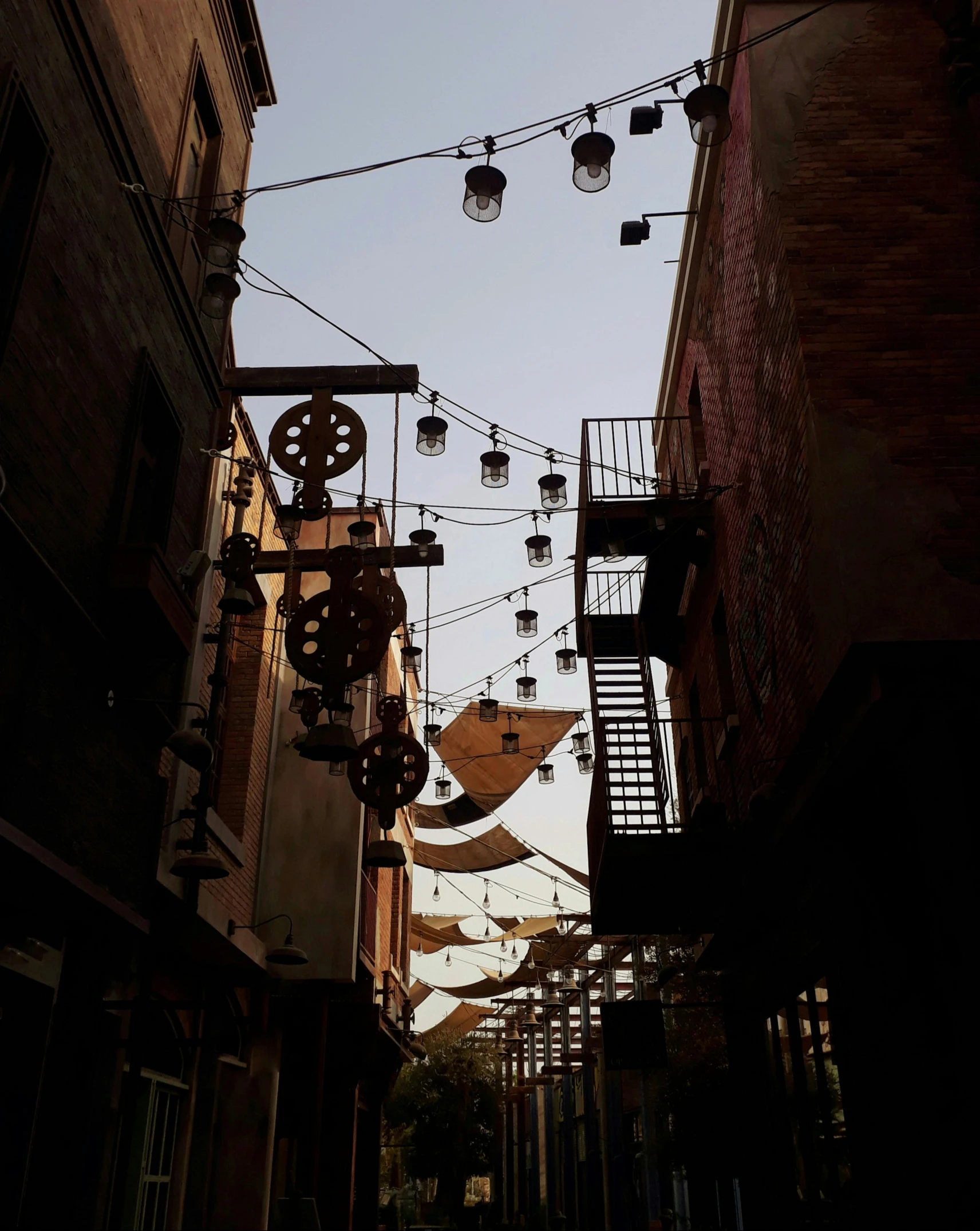 a set of light fixtures hang from clothes pins