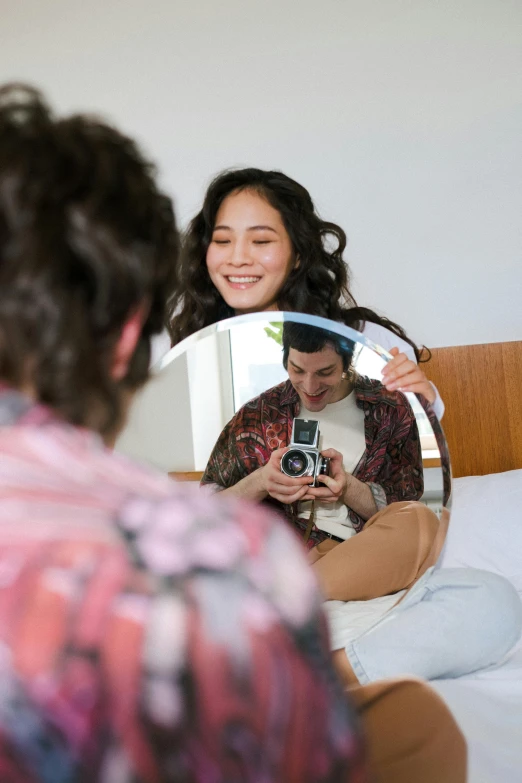 woman taking po of herself in the mirror