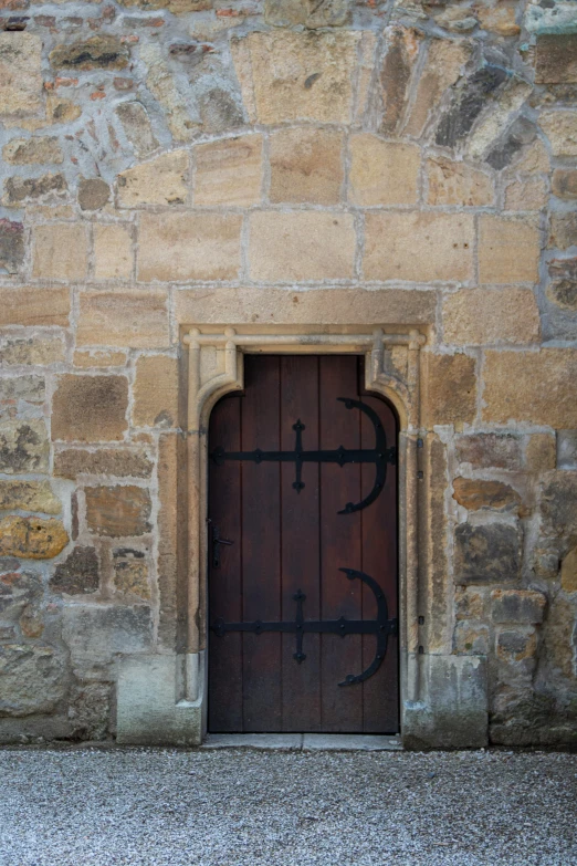 a brick building with a large wooden door