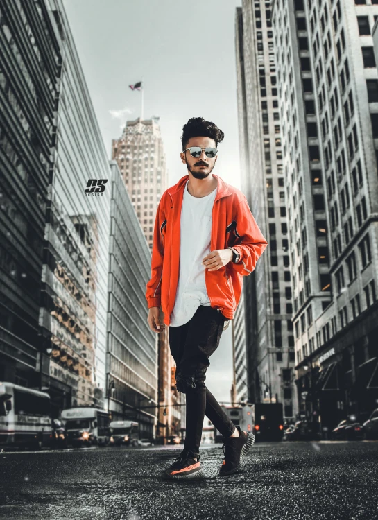 a person standing on the ground in front of some tall buildings