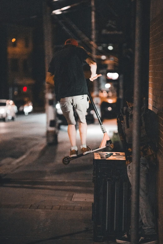 a person walking along a street at night