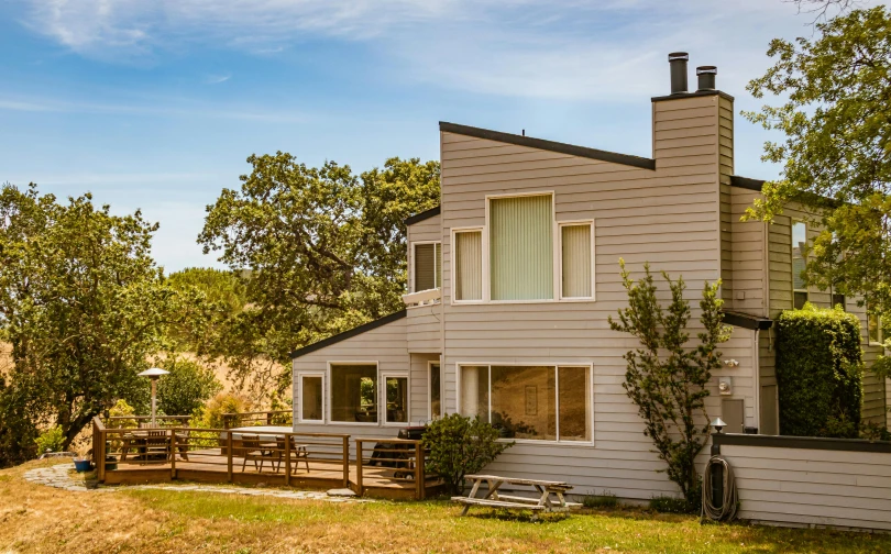 a home with several tables and some trees