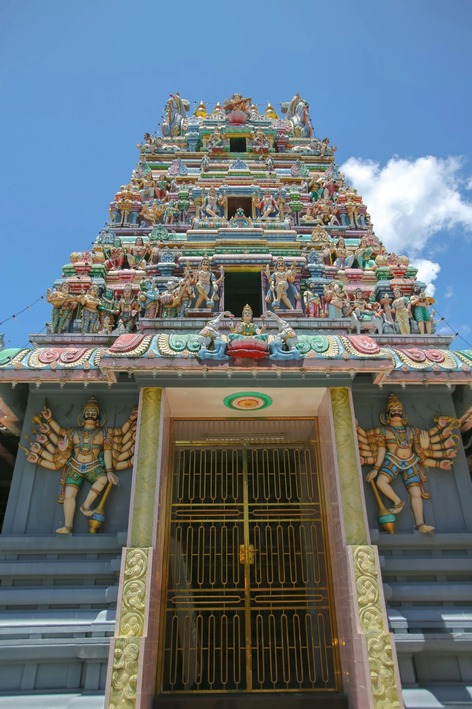 a doorway to a large ornate temple in india