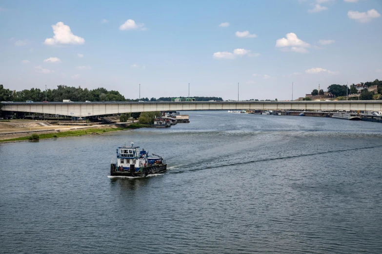 the motorboat passes under a bridge in the water