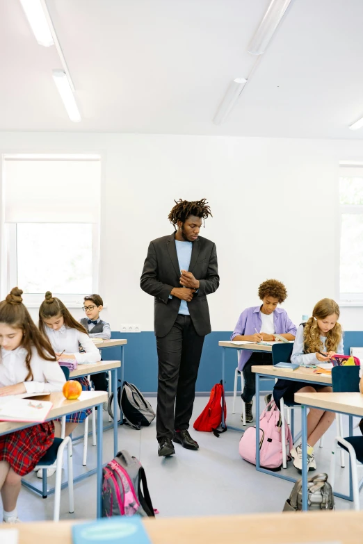 a teacher in a classroom with his students