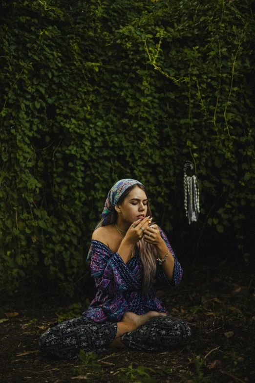 a woman in the woods on her cell phone