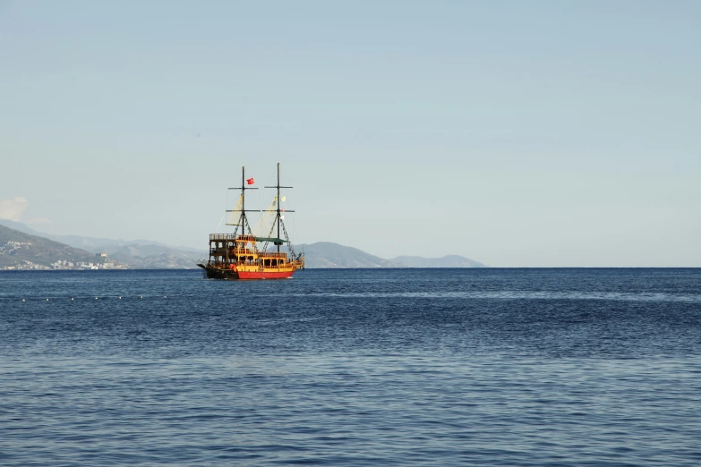 a boat floating in the middle of a large body of water