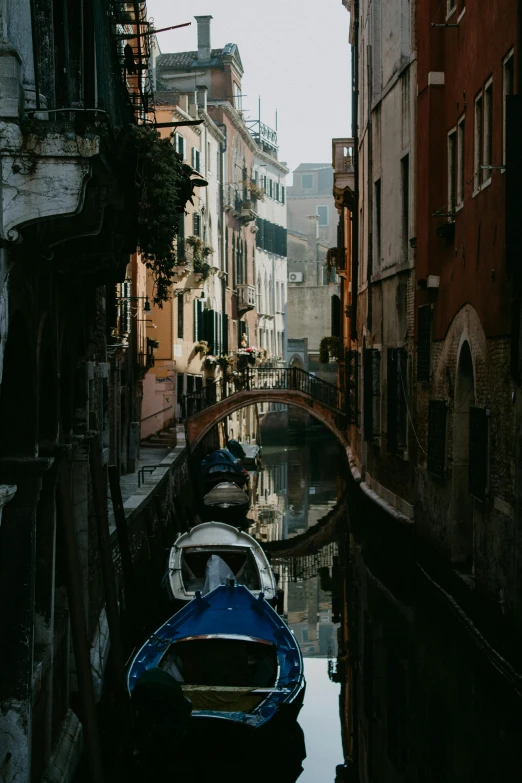 the water is reflecting all the buildings along the canal