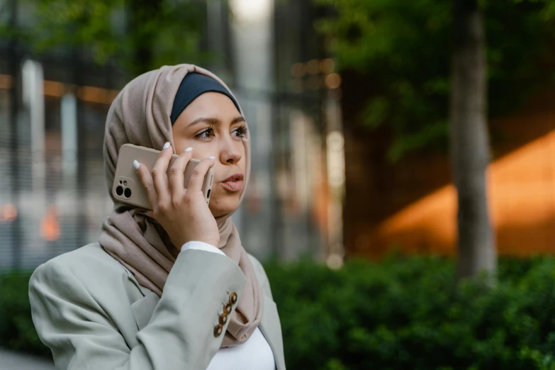 an arabic woman talking on her cell phone