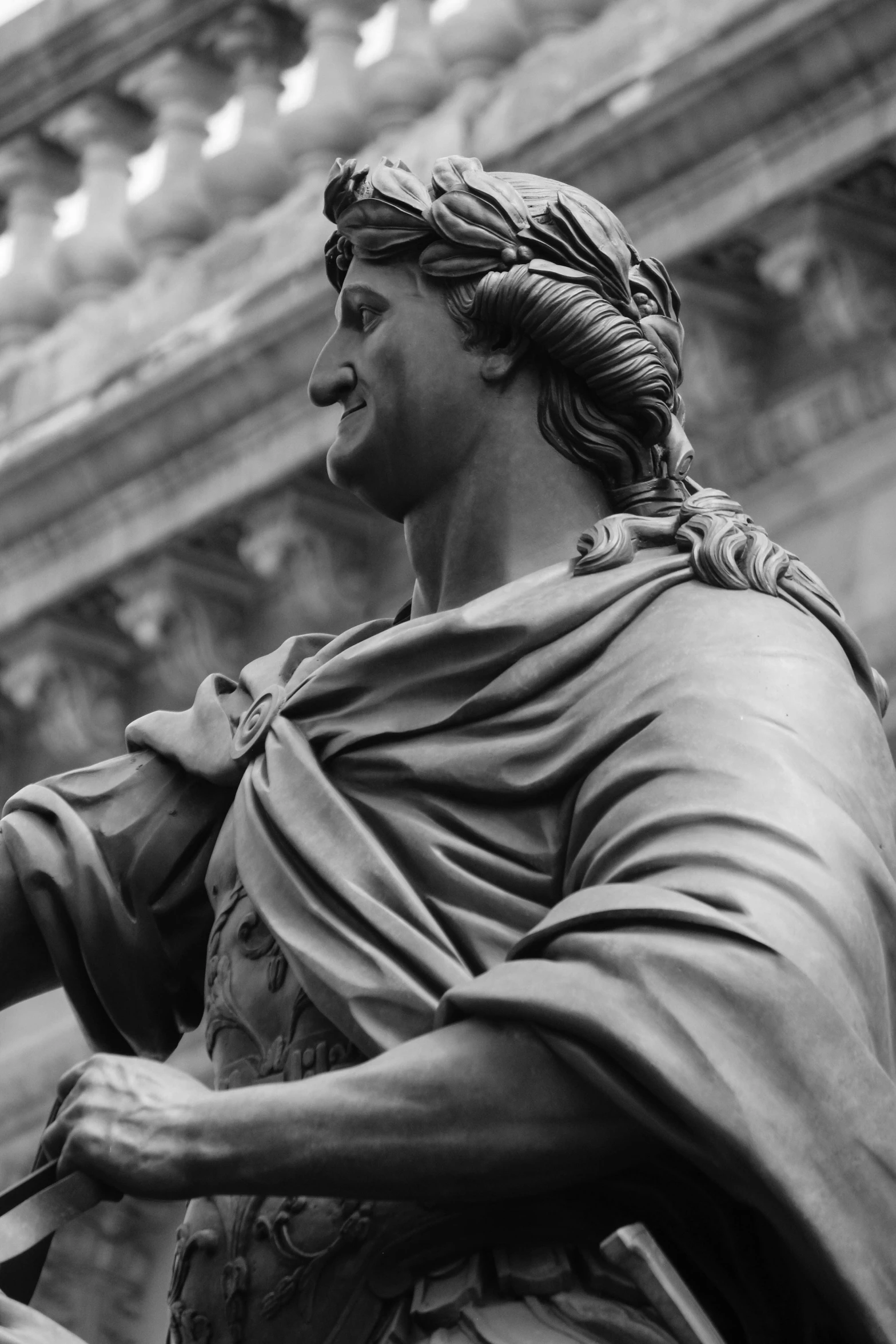 a statue sitting inside of a stone building