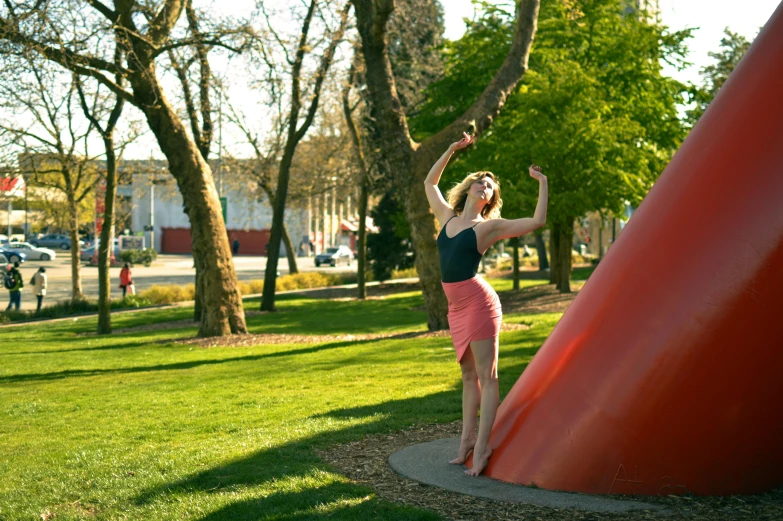 a woman posing with her arms out in the air