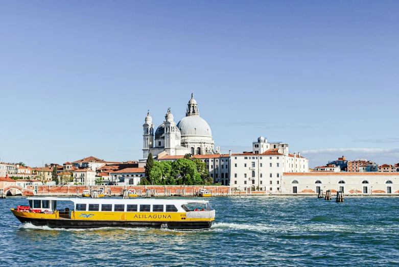 a boat on the river near a large building