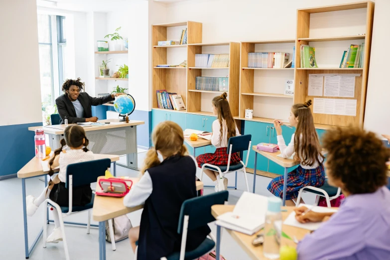 a class room with two students and one man