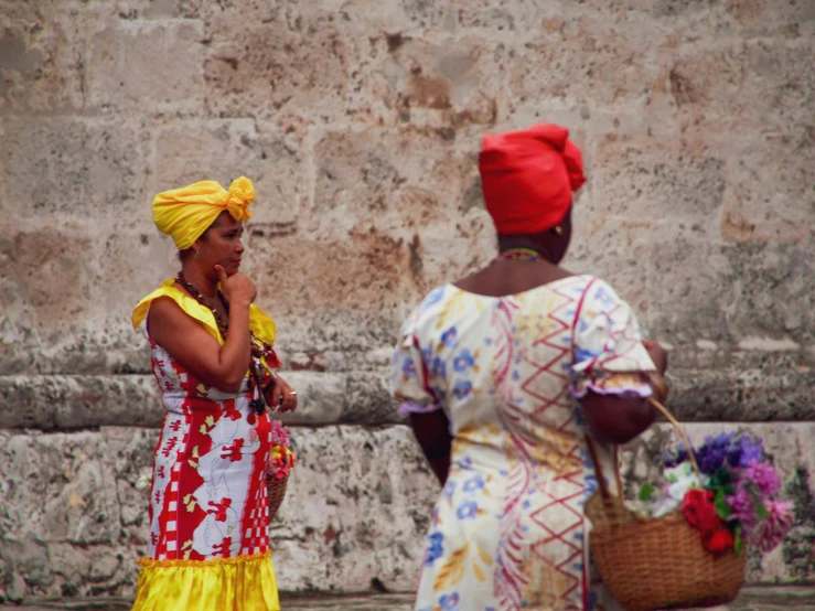 some very cute women in colorful clothes