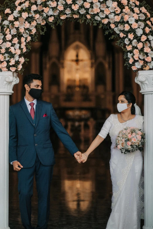 couple at ceremony wearing face mask as husband and wife