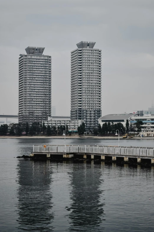 a couple of tall buildings in a big city