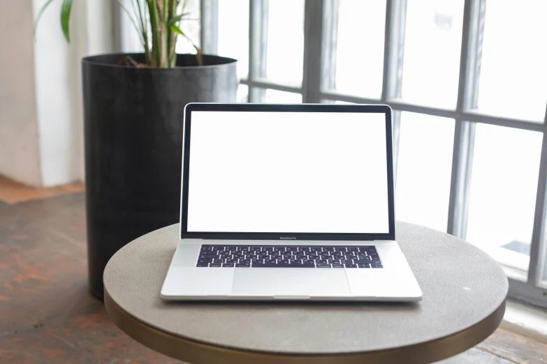 a laptop computer sitting on top of a table