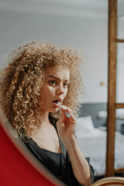 an image of a woman that is brushing her teeth