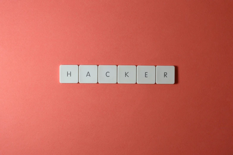 four white pieces of paper arranged on top of each other that spell out the word hackr