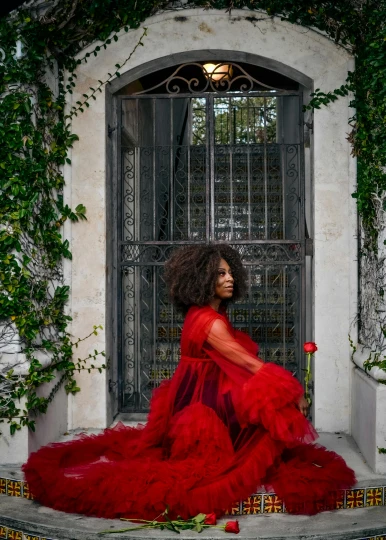 a beautiful black woman wearing a red dress