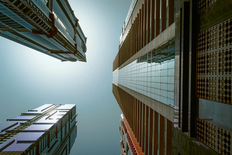 two buildings are seen from the ground to the sky