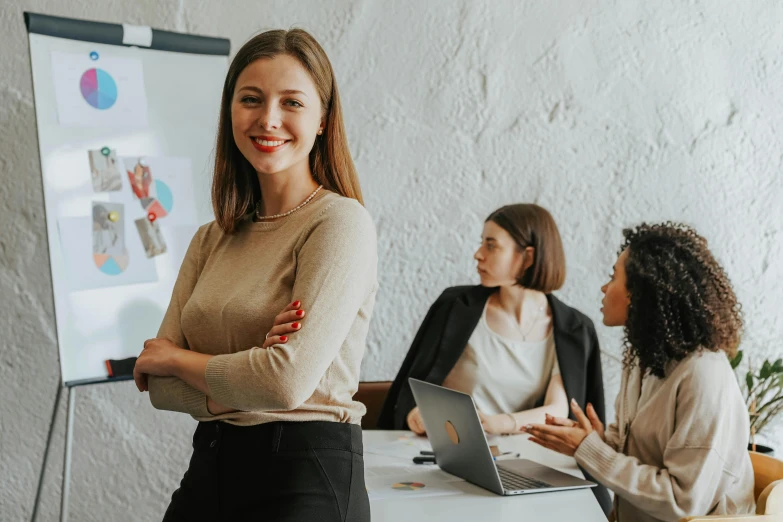 a woman in a business meeting is smiling at the camera