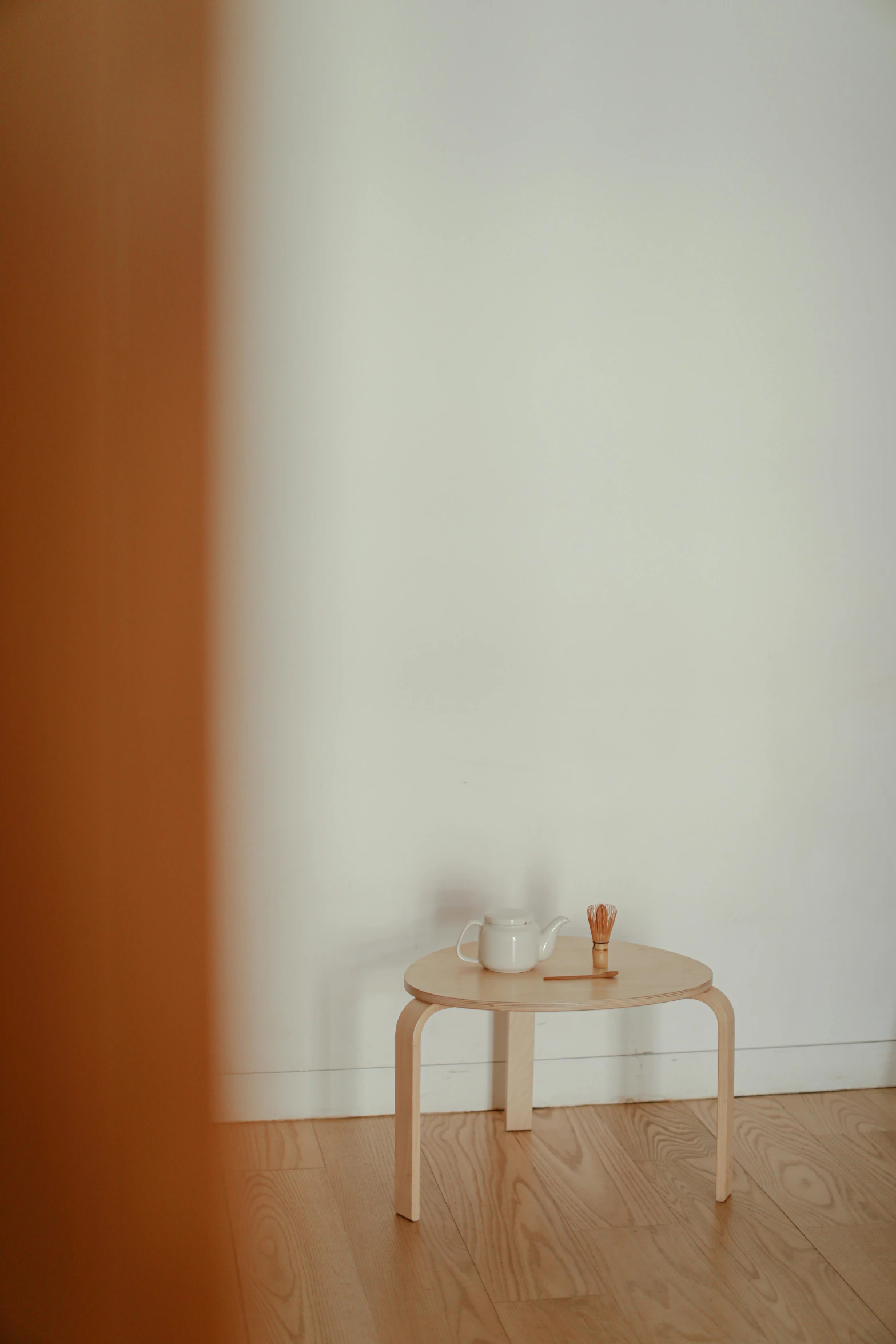 a small table with two cups sitting on it