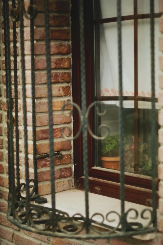 a window with bars and windowsills in front of it