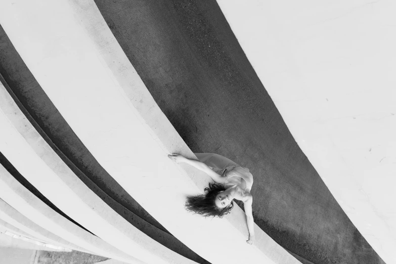 an aerial view of a person standing on the edge of a surfboard