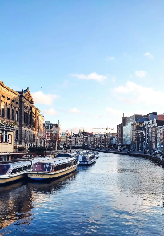 a waterway has boats and buildings along it