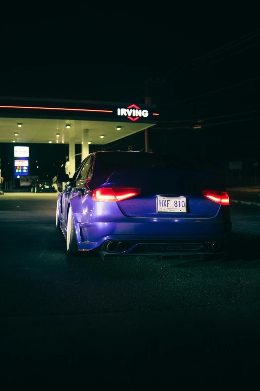 a car is parked at the gas station