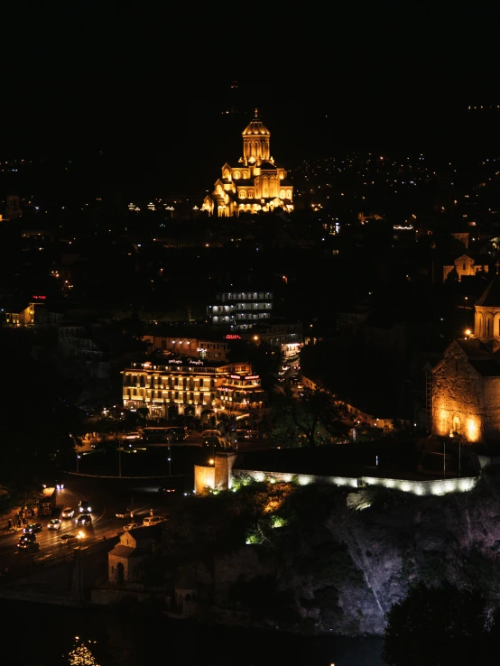 nighttime pograph of the lights of the city and church