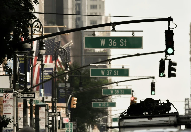 street lights and signs giving directions in an urban area