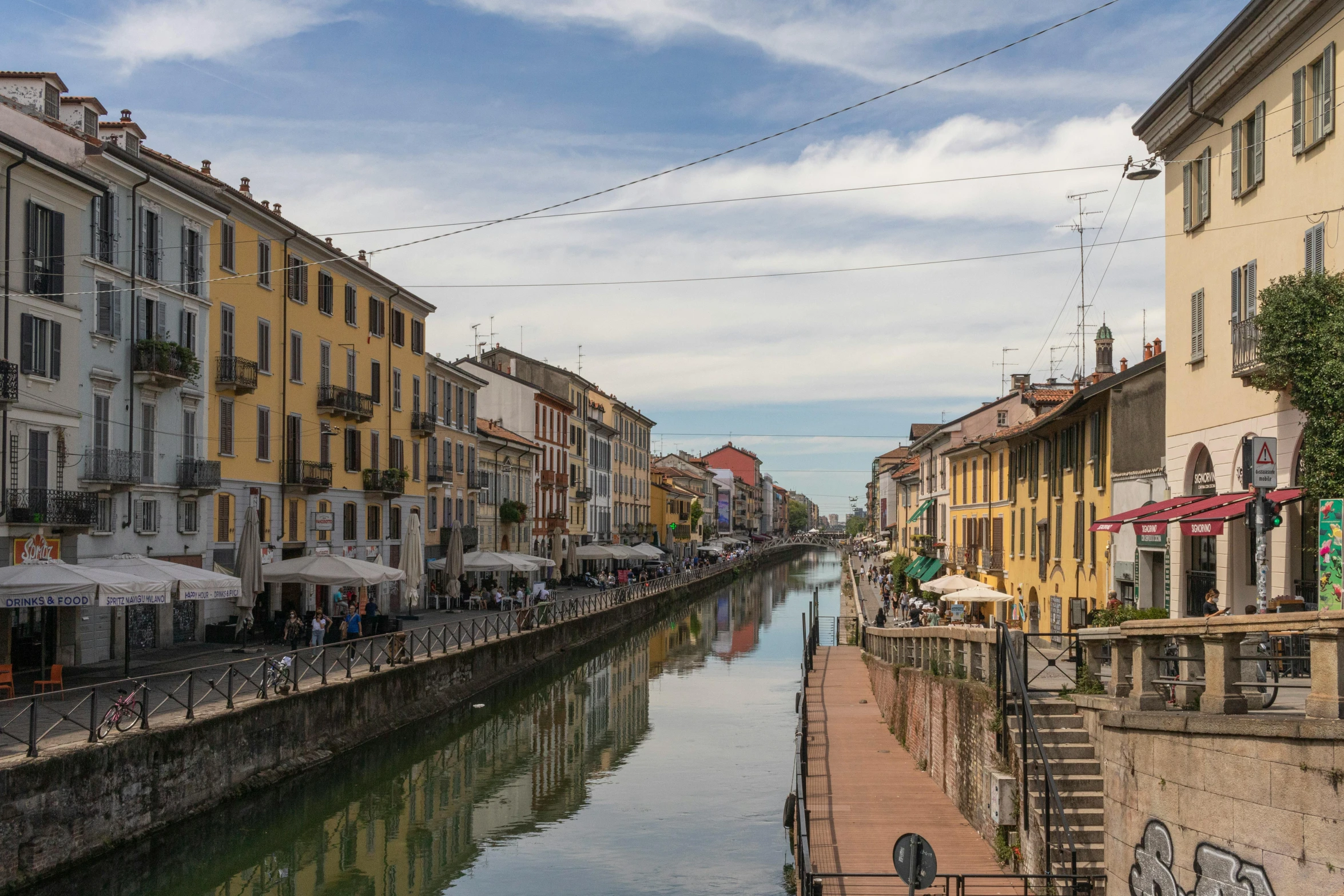 a city with a few buildings on either side of a waterway