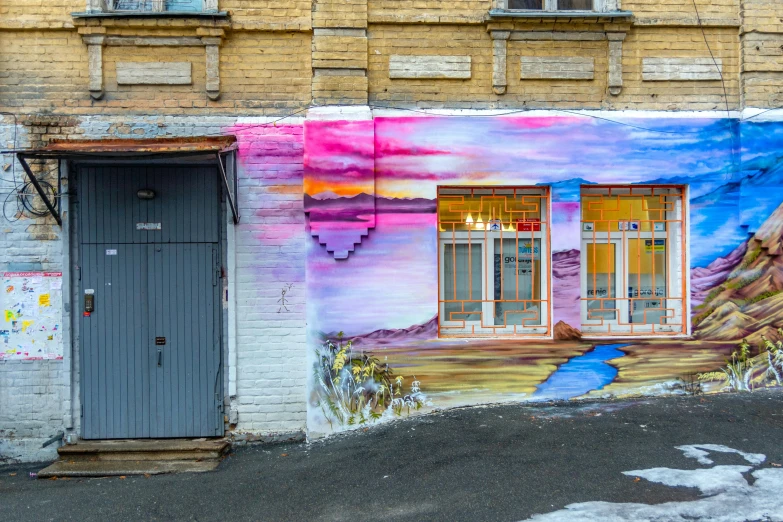 a mural of colorful windows and a large mountain in the background