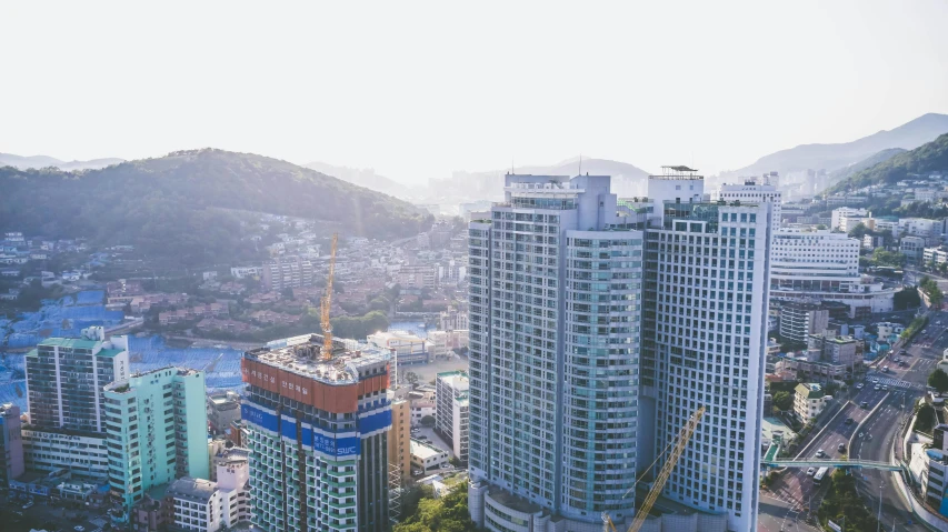 the skyline of an asian city with many tall buildings