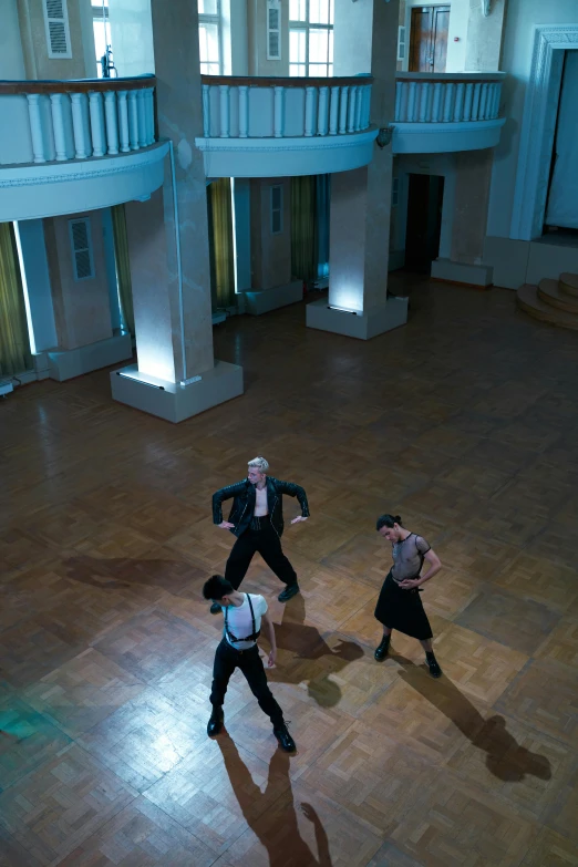 two dancers with black suits and white shirt