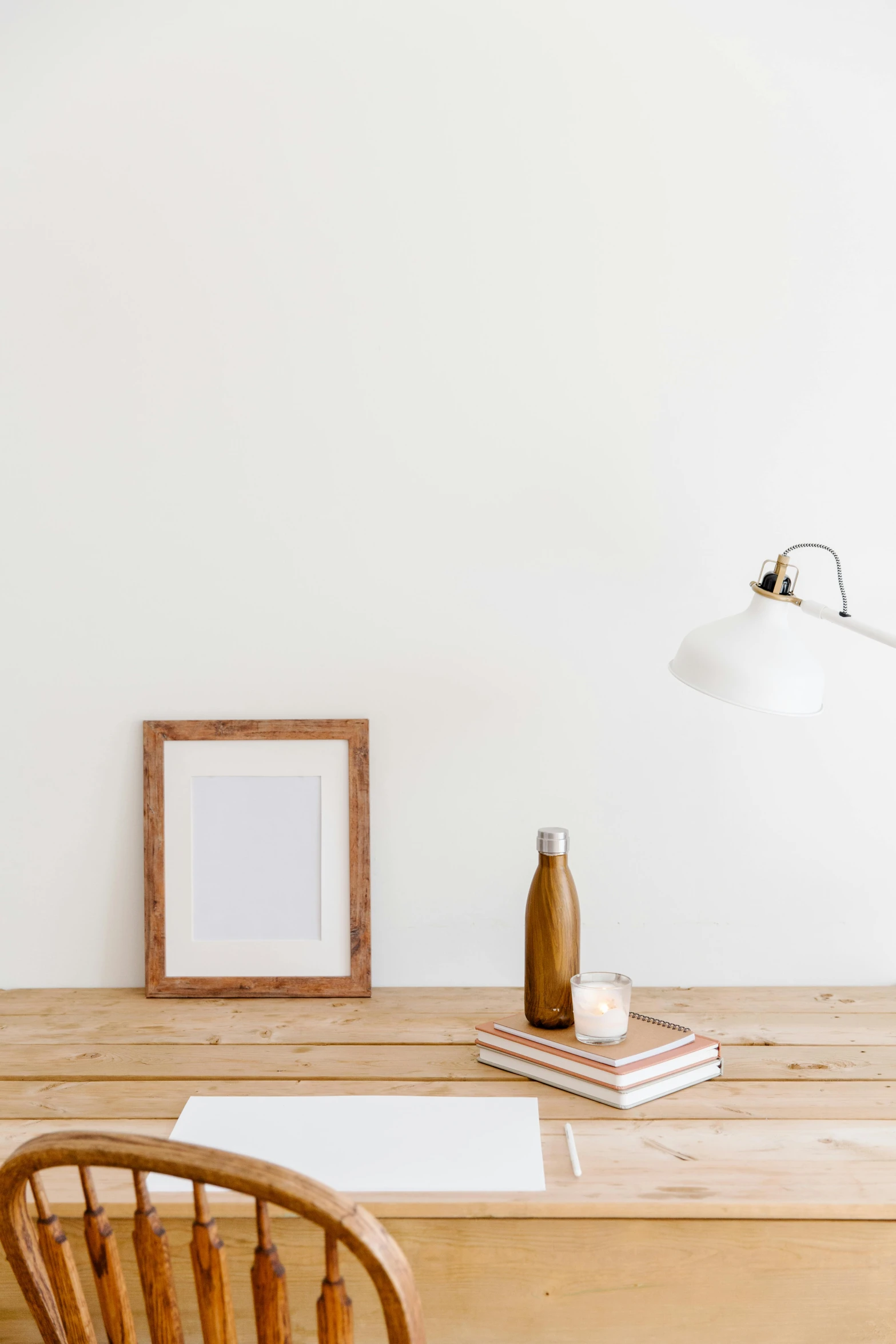 a picture frame and some books on a table