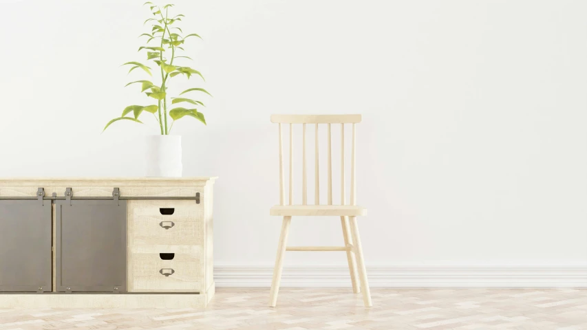 a white chair near a cabinet and a plant