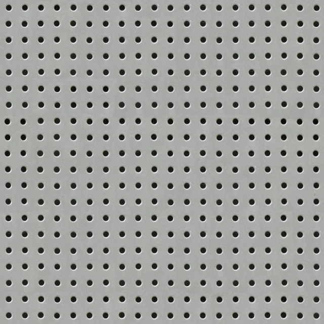 there is a very large grate that has black dots on it