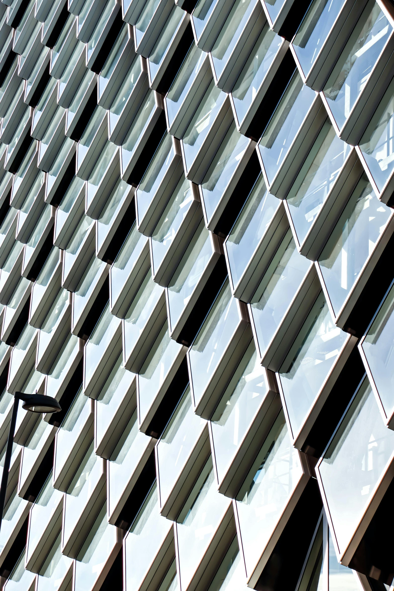 an unusual building with many pieces of windows