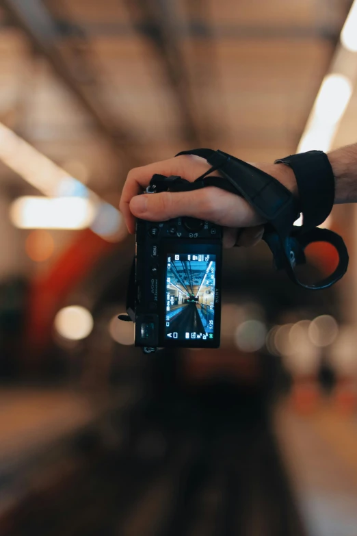 a person holding up a camera to take a picture