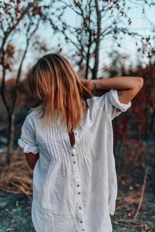 a person that is looking at the trees