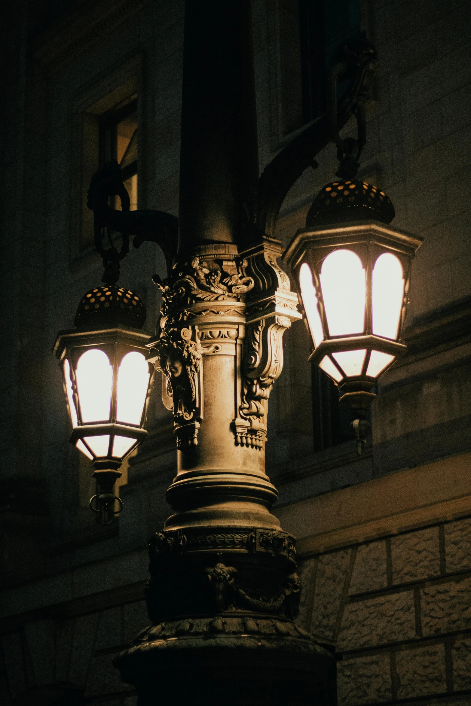 a large lamp post in front of some buildings