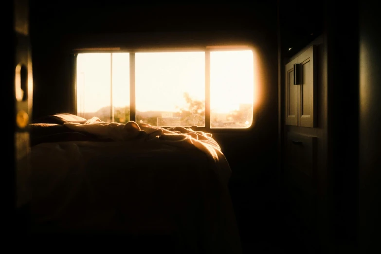 an image of a sun shining through a window